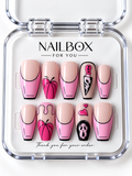 Pink Panic nude and bright pink press-on nails with black-outlined French tips, pink pumpkins, dripping details, knife artwork, and a spooky mask in a clear nail box.