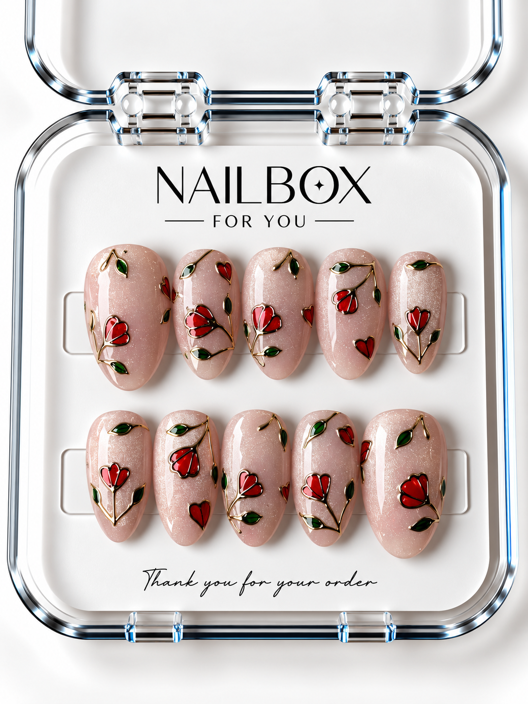 Love in Bloom shimmering blush pink press-on nails with red flowers, small hearts, green leaves, and gold-tone stems and outlines, displayed in a clear nail box.