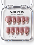 Blush Veil shimmering blush pink press-on nails with pearlescent pale pink French tips, soft swirled details, and thin gold-tone borders in a clear nail box.