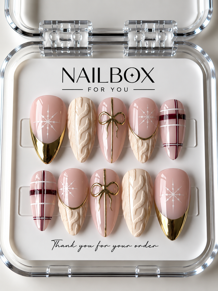 Winter Romance blush pink press-on nails with white snowflakes, cream knit textures, burgundy plaid and gold bows.